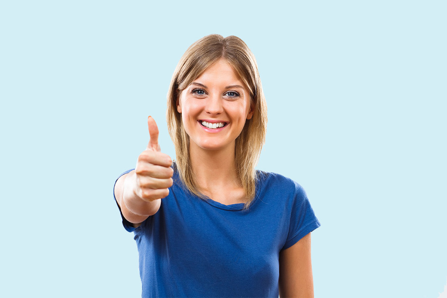 girl smiling and thumbs up