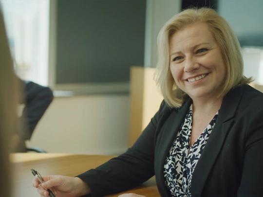 Claire Smiling in the Maven Dental board room 