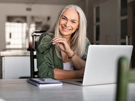 Mature woman working on laptop