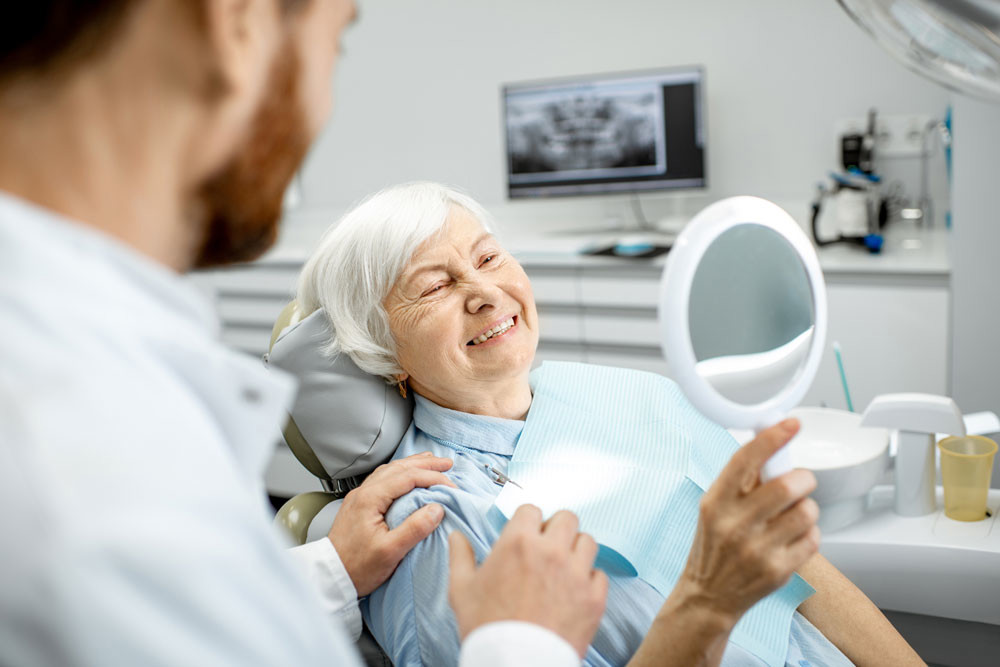 Elderly woman in dental chair 