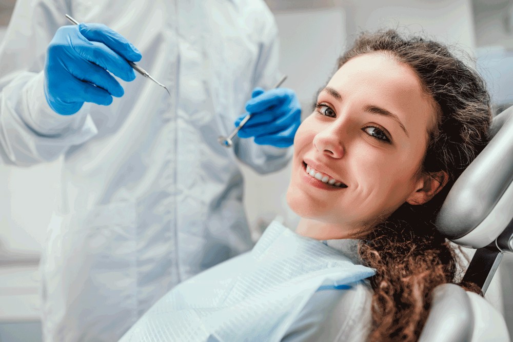 Woman feeling relaxed while sitting in dental chair